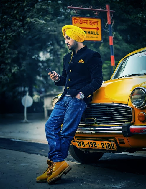 The Dashing Diljit Dosanjh Wallpaper In Yellow Turban And Car