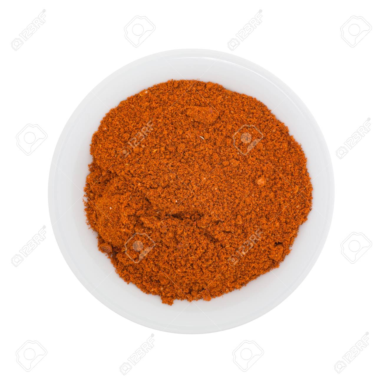 Top Of A Small Bowl Filled With Sriracha Seasonings Isolated