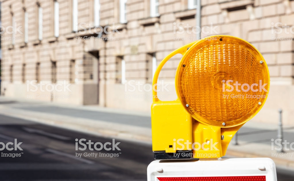 Construction Safety Street Barricade With Warning Signal Lamp On A