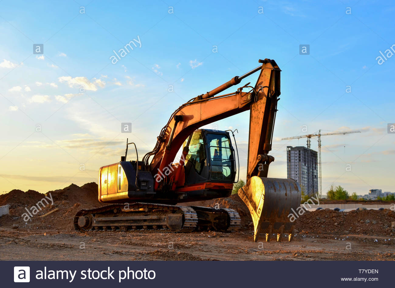 Heavy Tracked Excavator At A Construction Site On Background Of