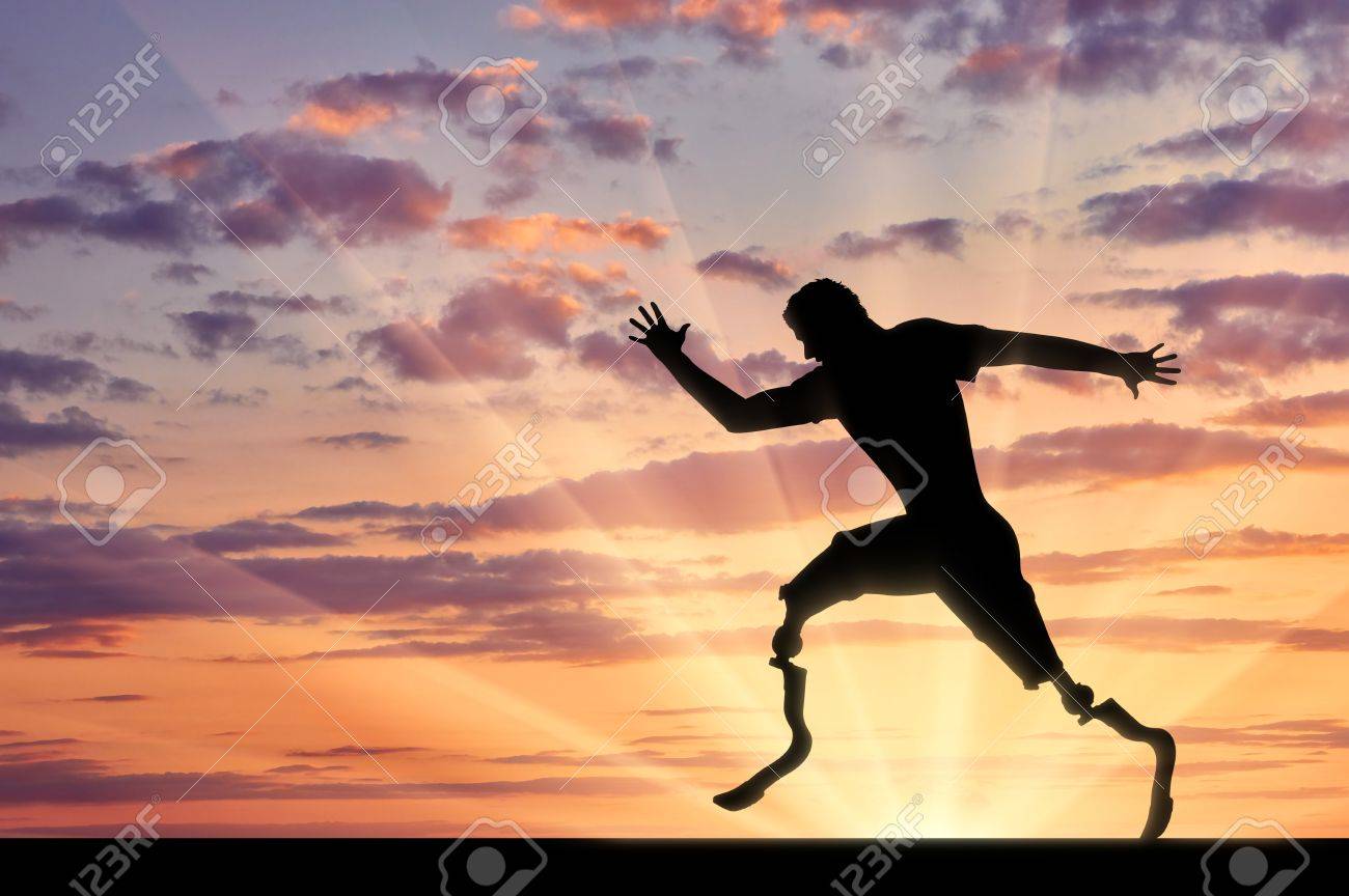 Disabled With Two Prosthetic Running On Sunset Background Concept