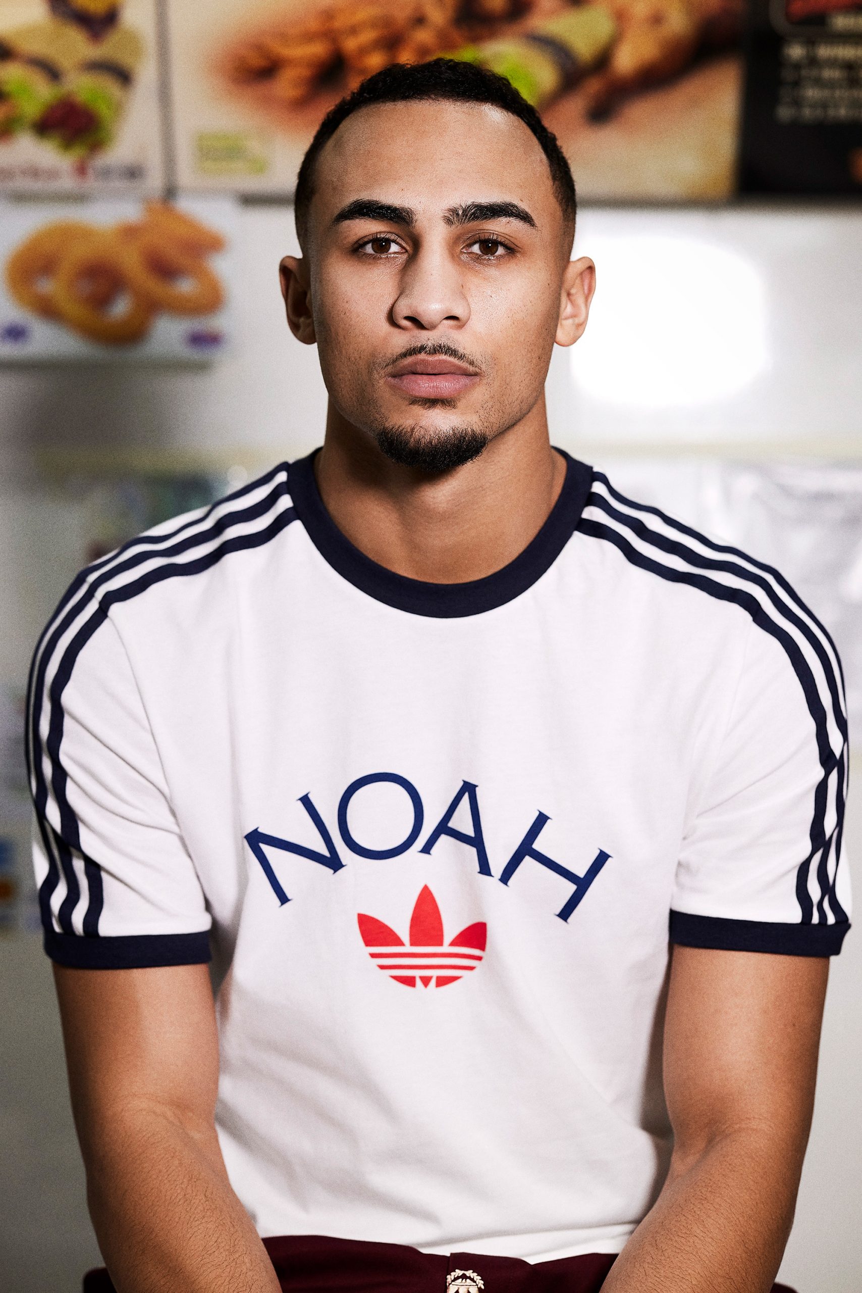 Benjamin Whittaker posing in a Noah x Adidas T-shirt