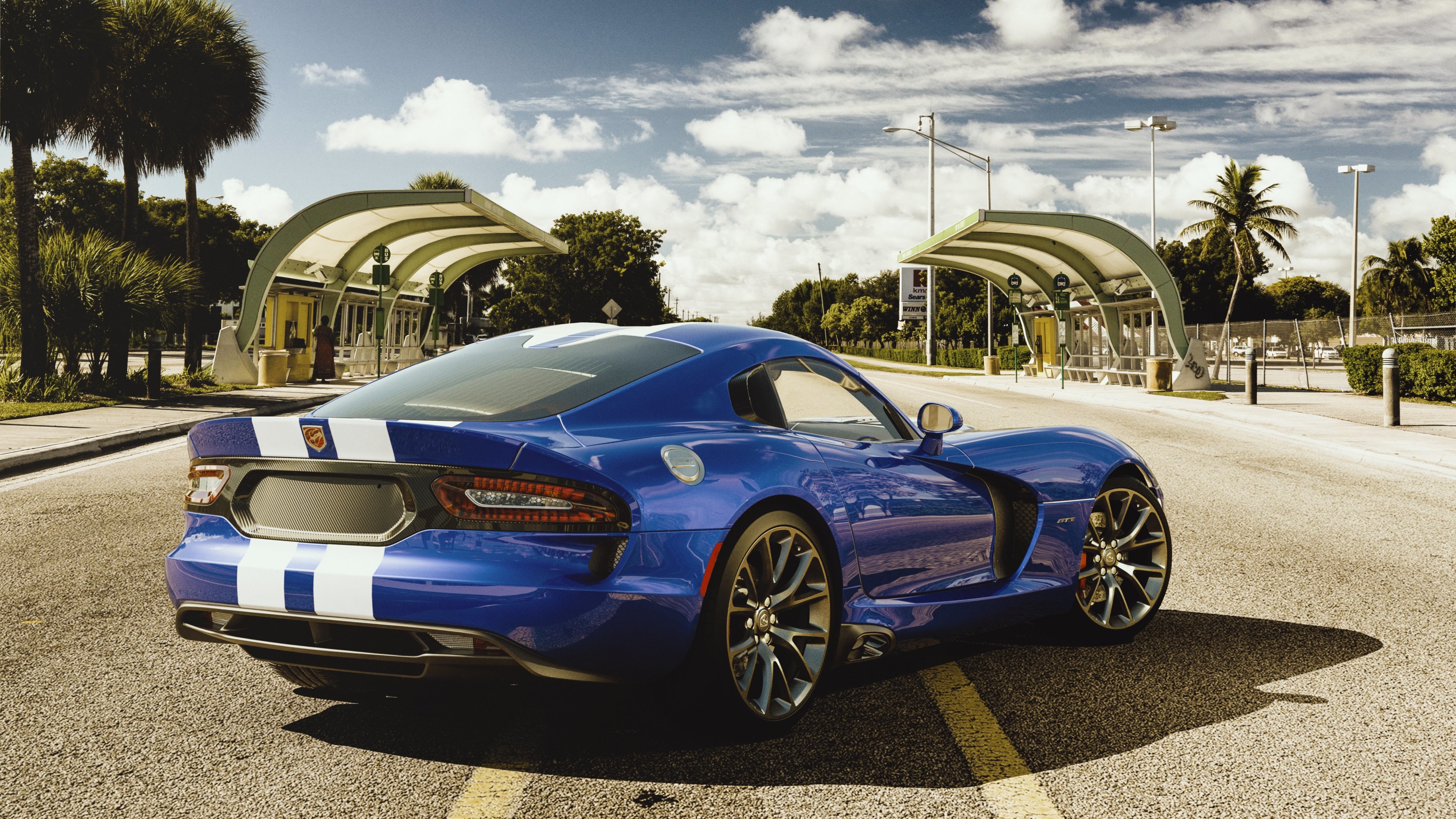 Blue Dodge Viper parked on a street, showcasing its sporty design and powerful presence
