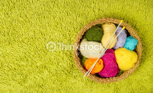 Knitting Yarn Balls And Needles Green Carpet Background