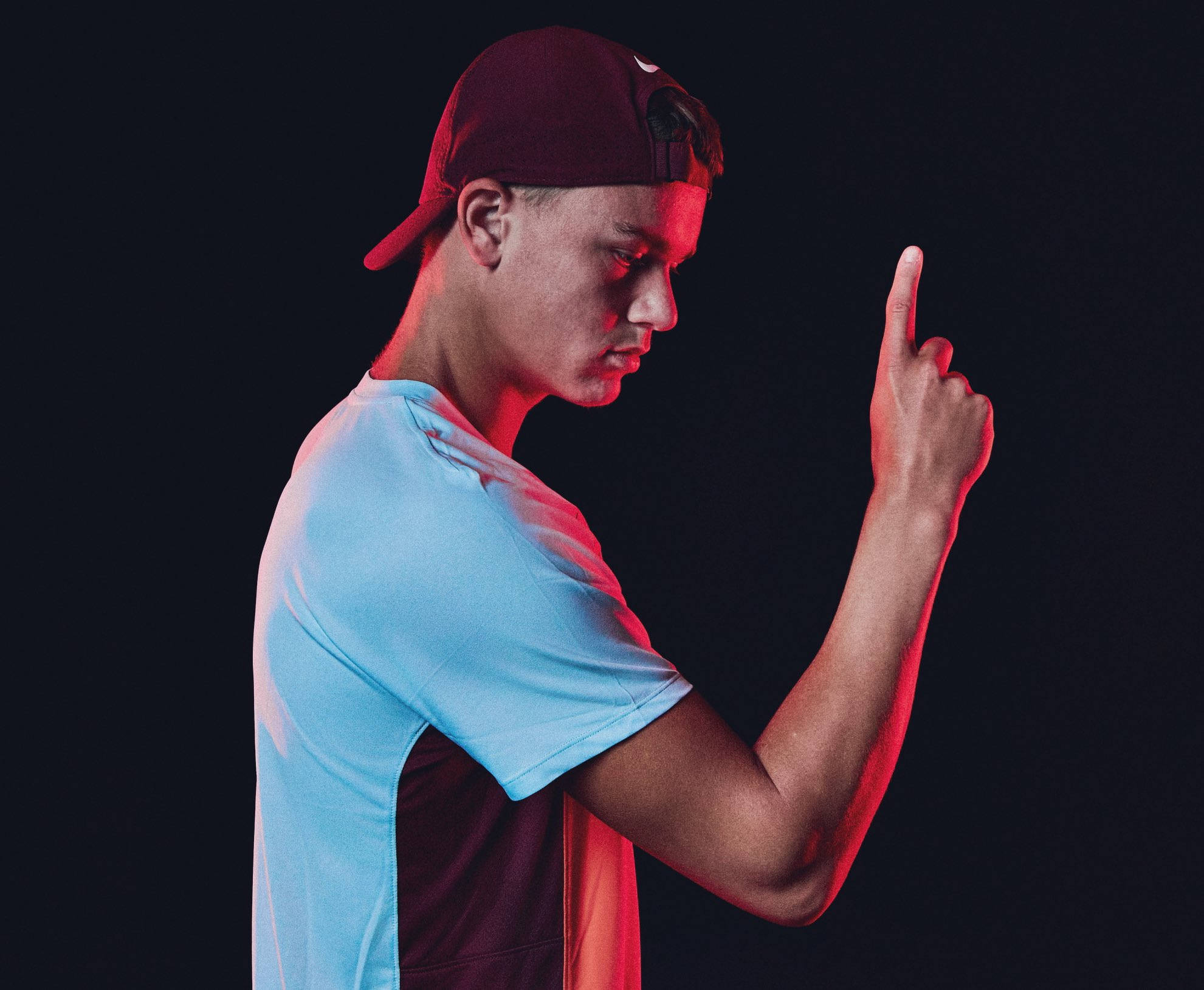 Emerging Tennis Star Holger Rune In Action Wallpaper