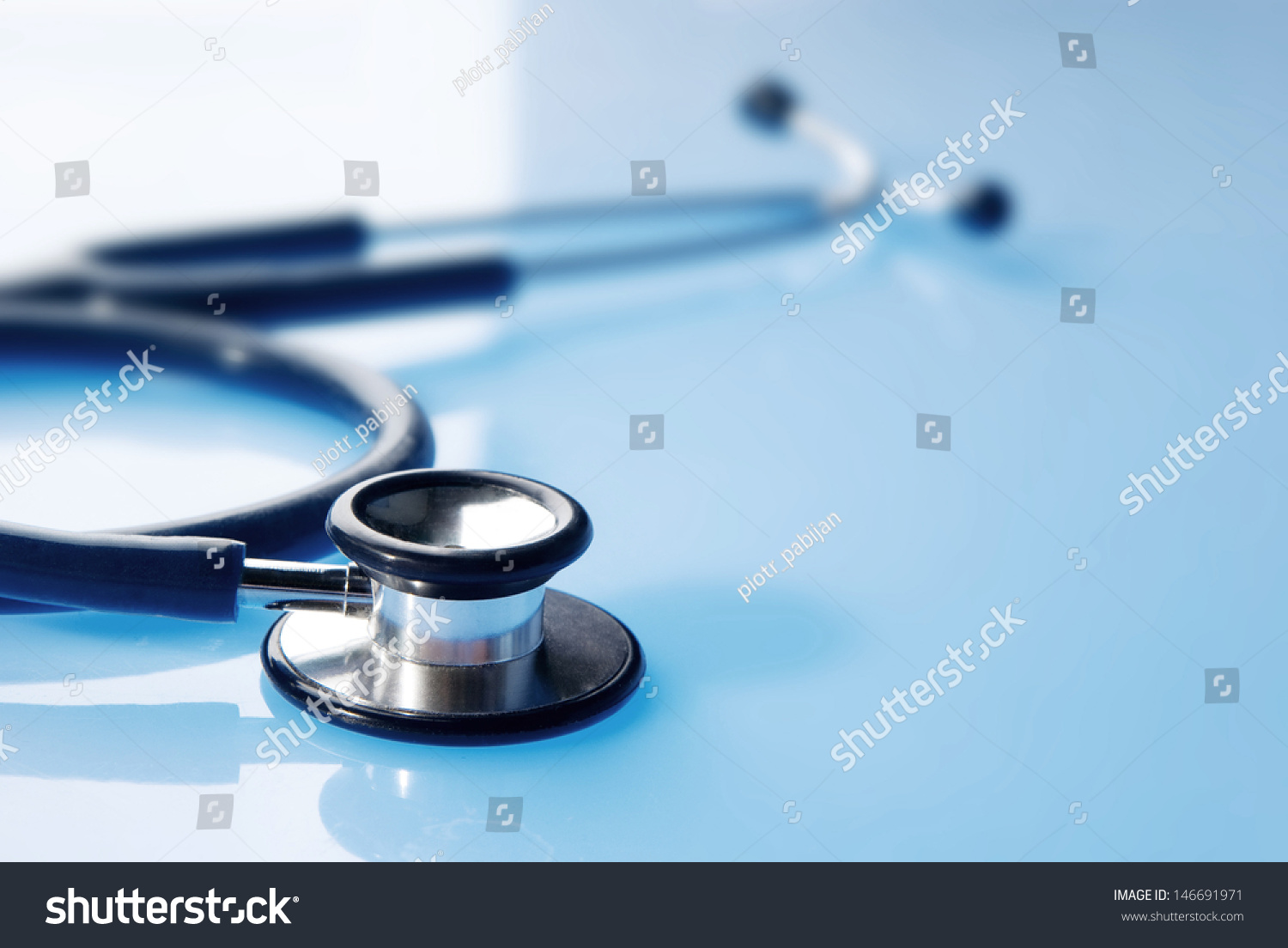 Stethoscope On Blue Reflective Background Stock Photo