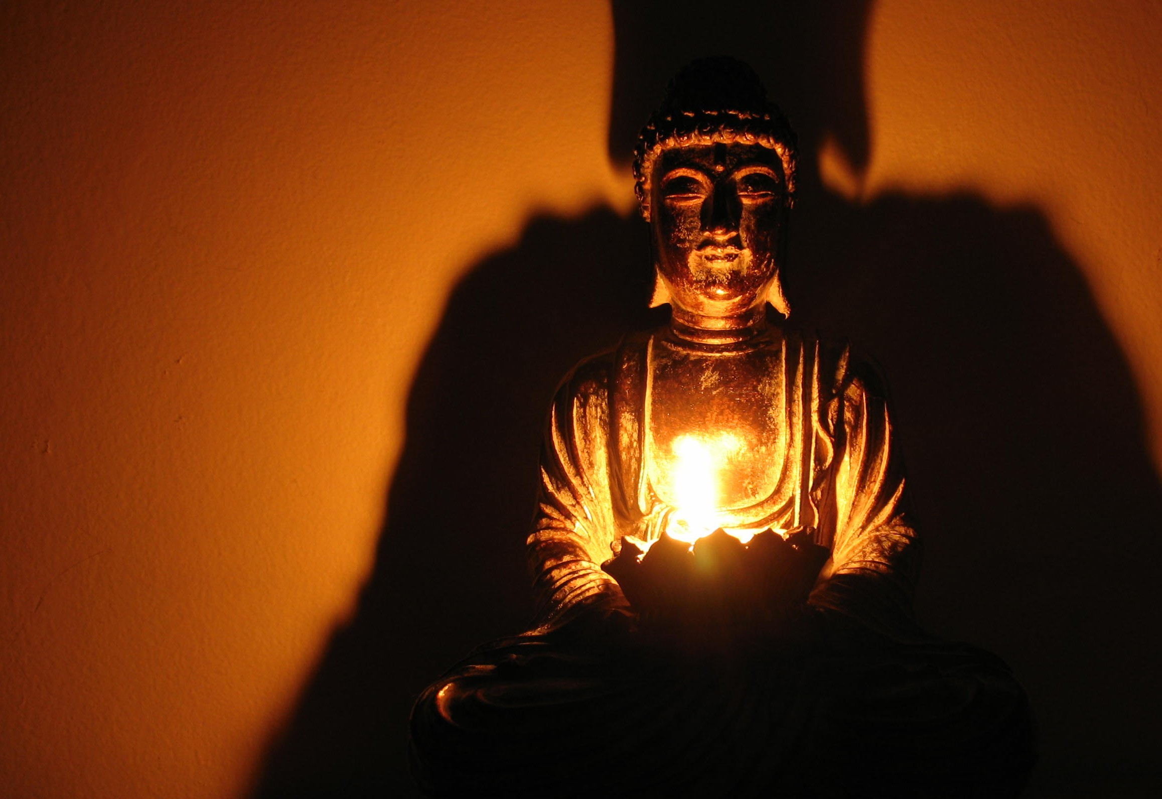 Serene Buddha Statue with Candlelight