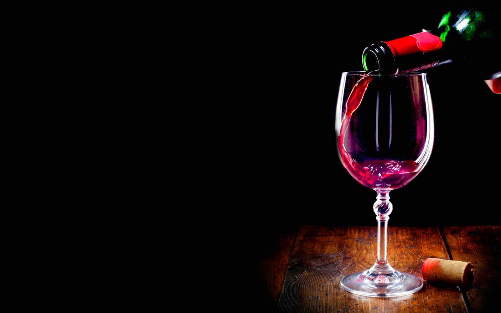 Glass of red wine wide desktop background