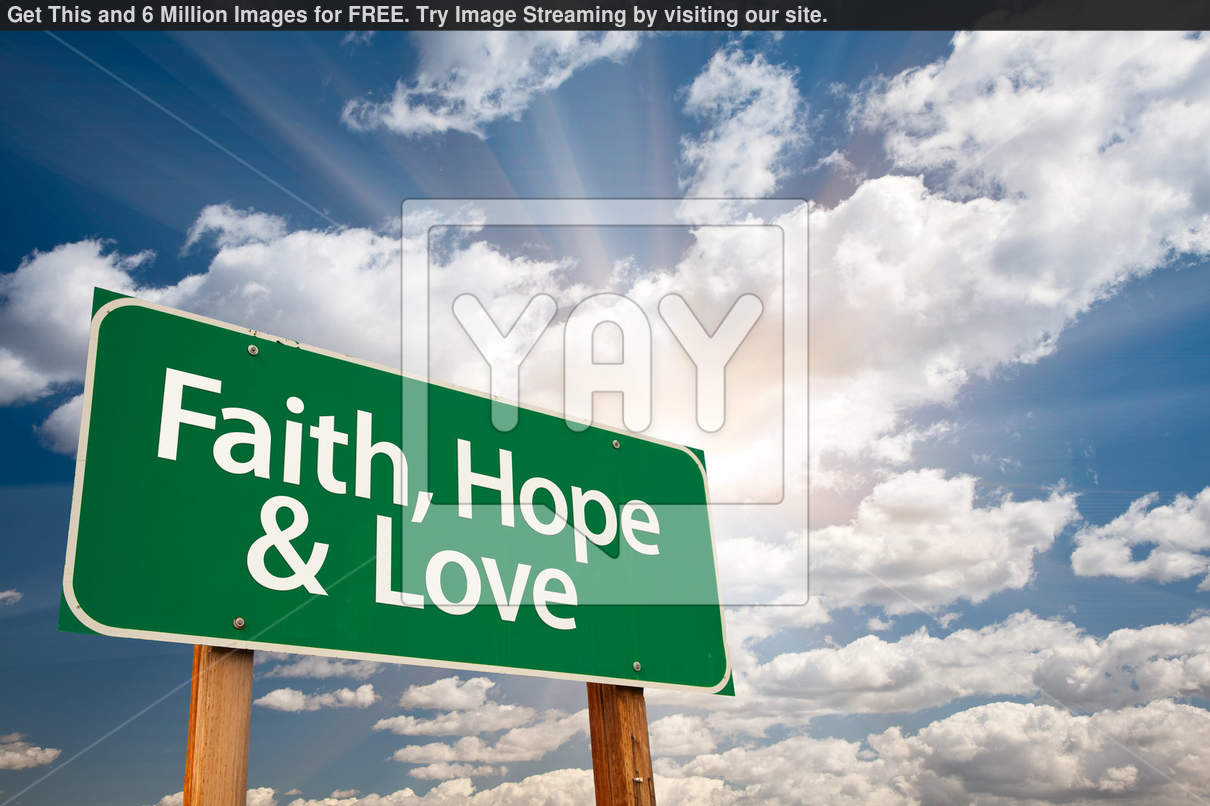 Royalty Free Image of Faith Hope And Love Green Road Sign