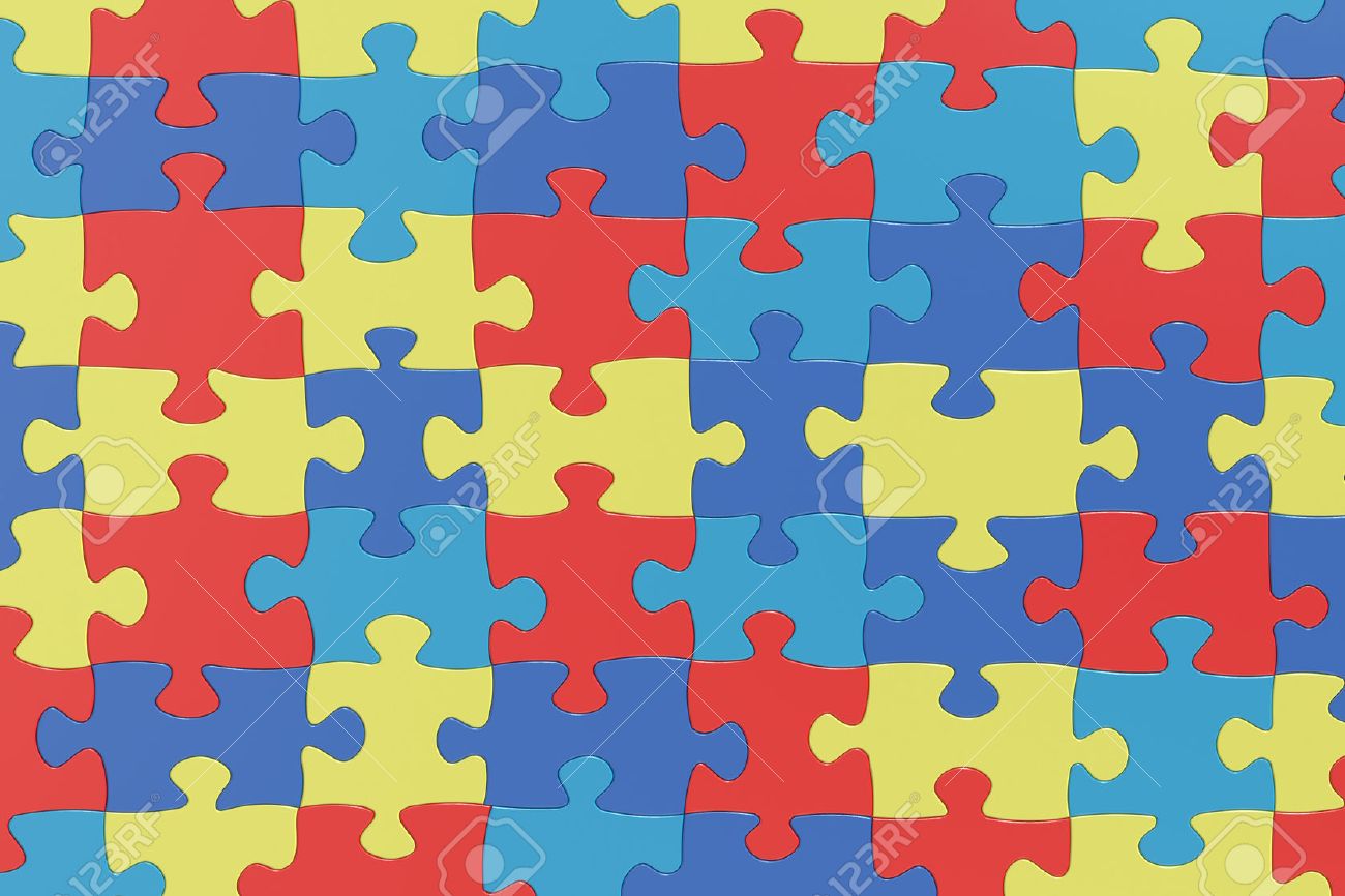 Puzzle Pieces In Autism Awareness Colors Background 3d Rendering
