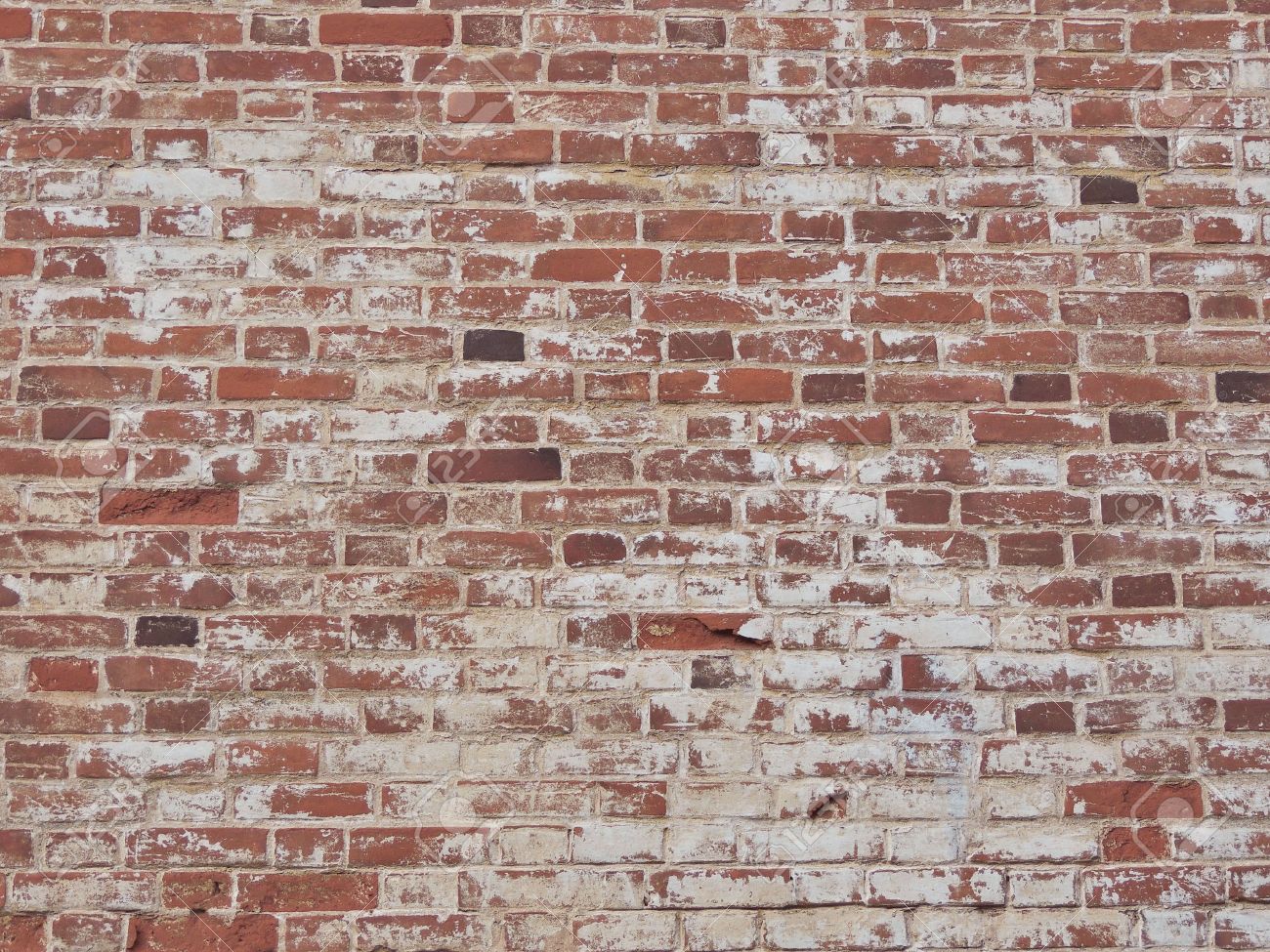 Old Red Brick Wall With Shabby Paint Background Stock