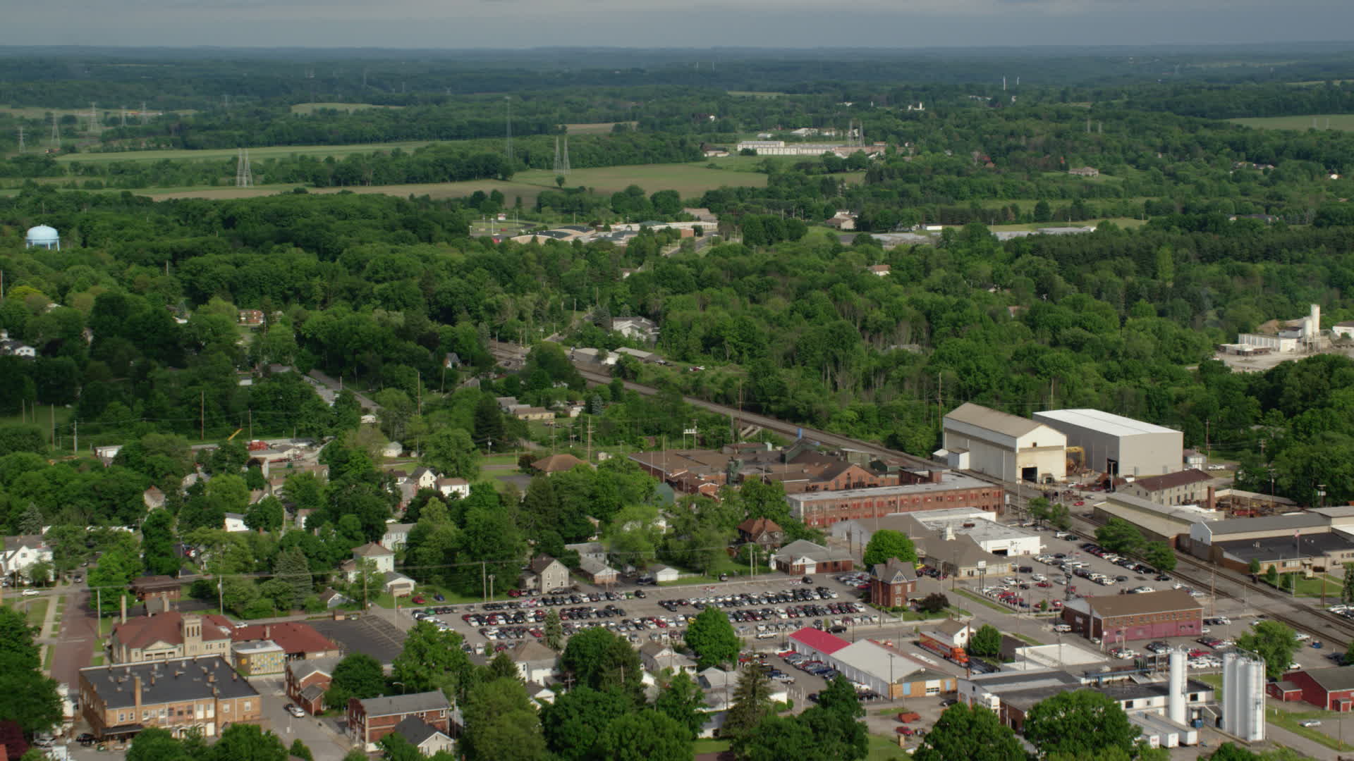 5k Stock Footage Aerial Video Flying Over Small Town Toward A School