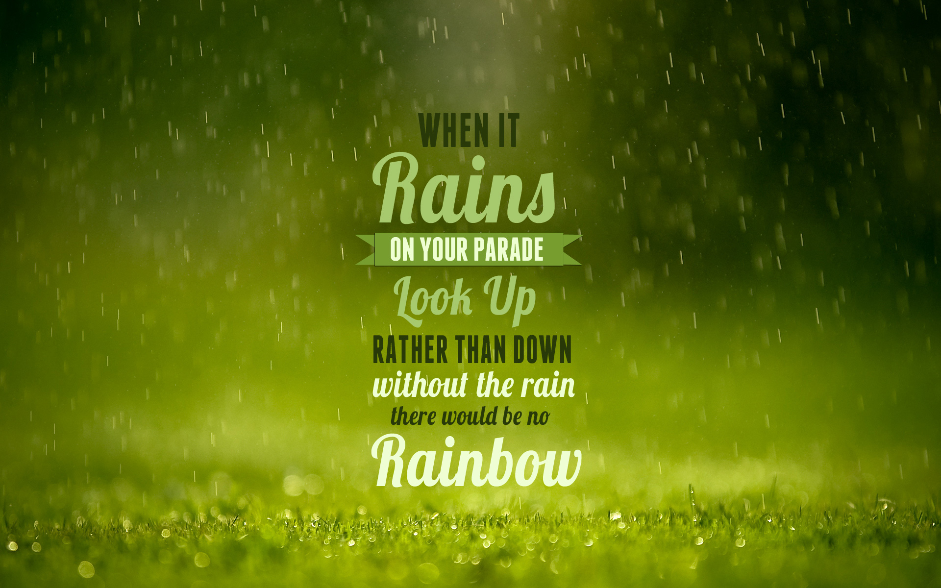 Inspirational quote on a rainy background with grass. Text reads 'When it rains on your parade, look up rather than down. Without the rain there would be no rainbow.'