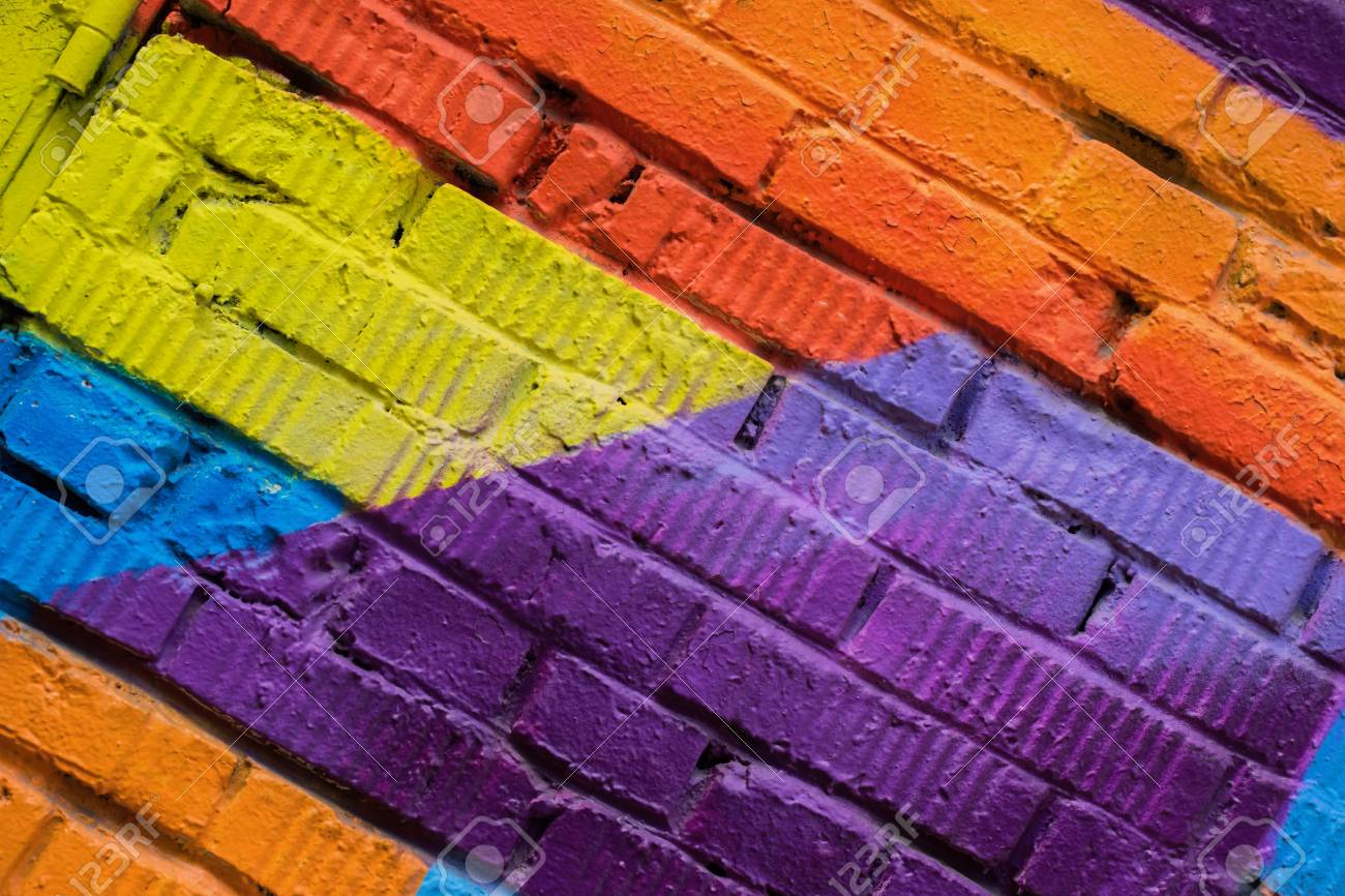 Abstract Detail Of Brick Wall With Fragment Colorful Graffiti