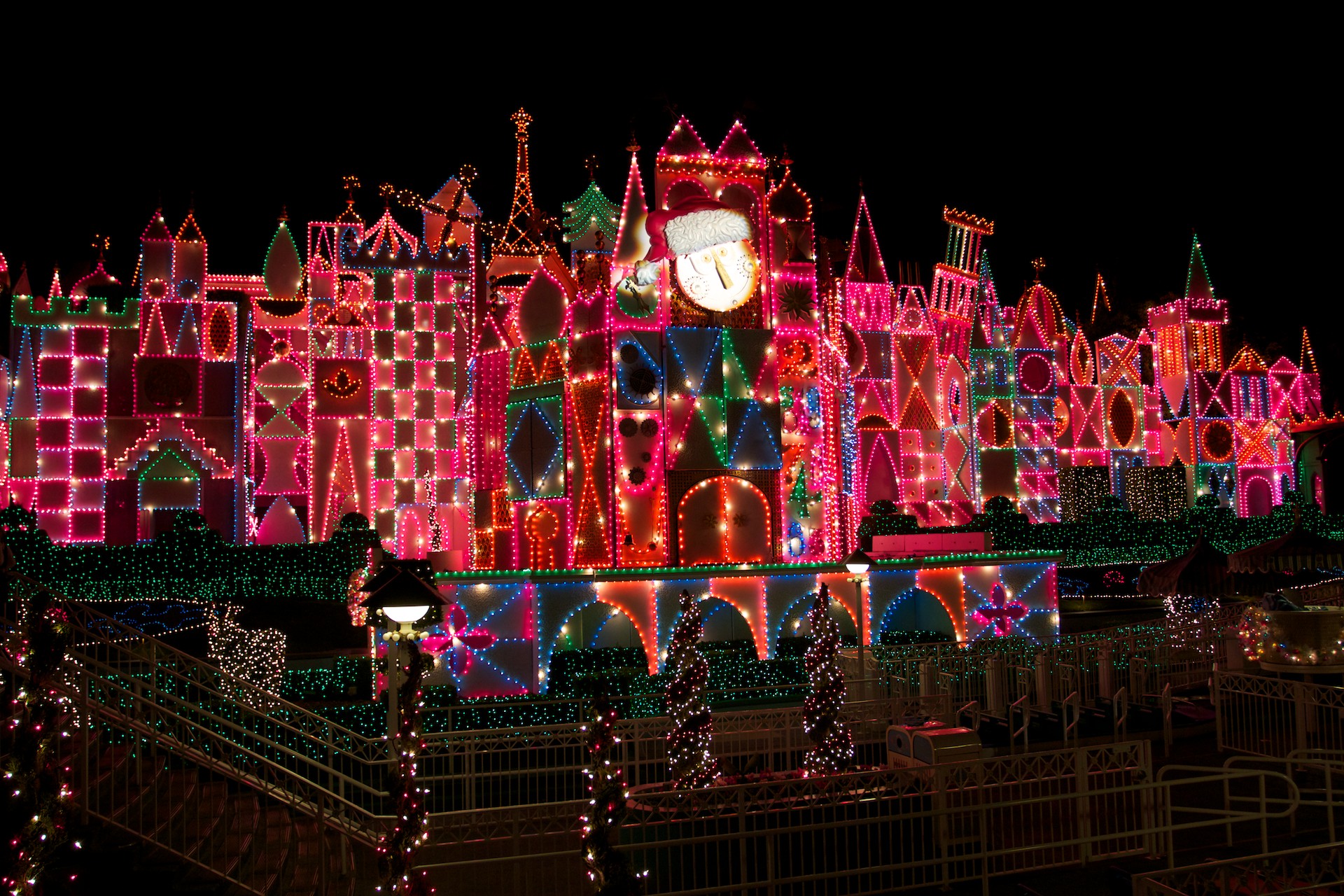 Attraction At Disneyland Night Decorated For Christmas Wallpaper