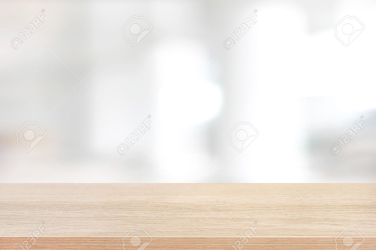 Wood Table Top On Blurred White Background Of Building Hallway