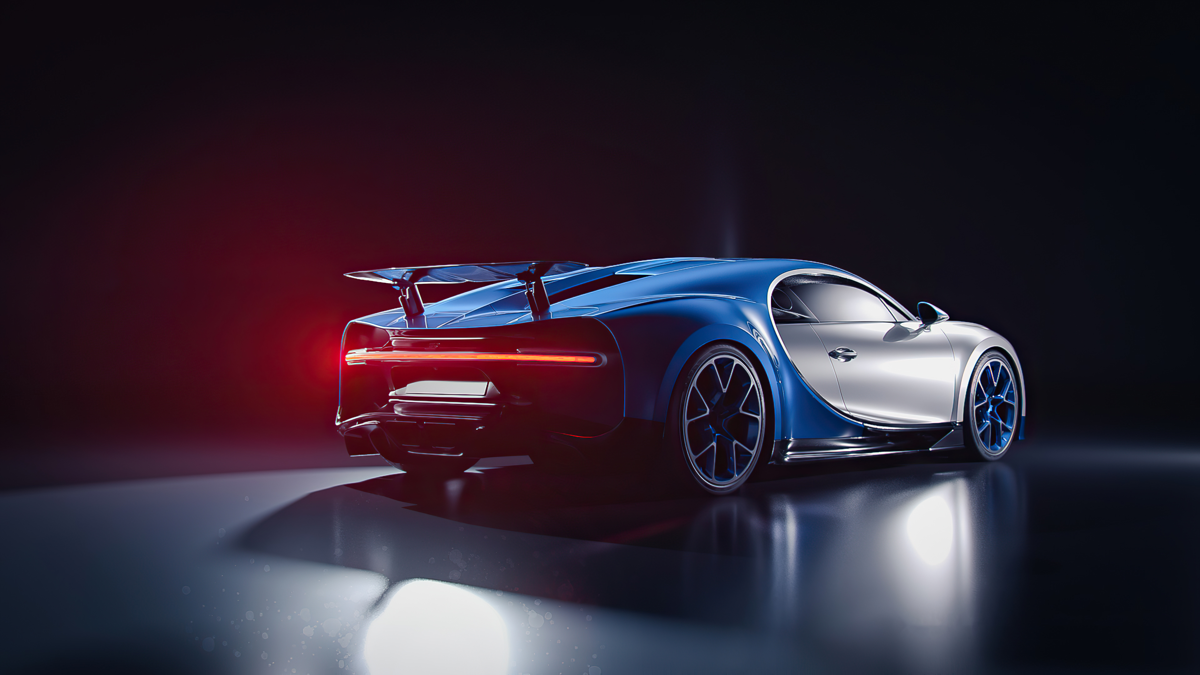 A sleek and stylish Bugatti sports car in a dark studio setting, highlighted with blue accents