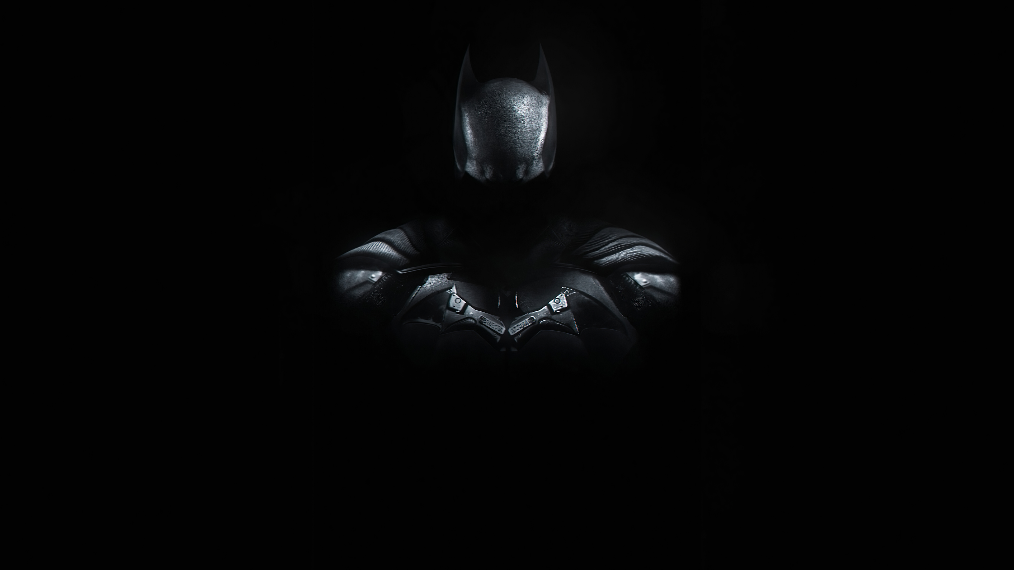 Dark 4K wallpaper featuring a shadowy figure of Batman against a pitch-black background