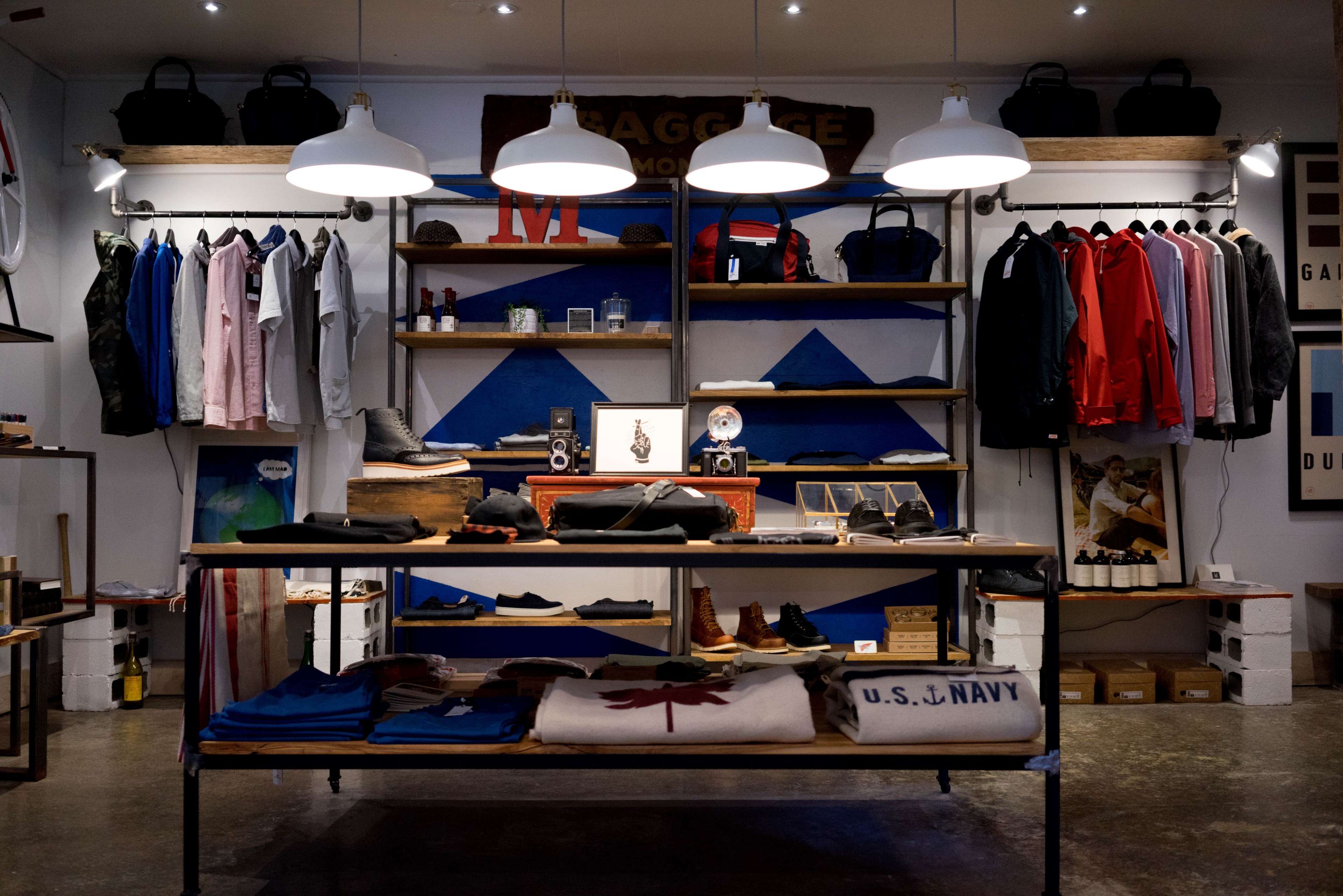 Racks With Mens Apparel On The Walls Of A Clothes Store Organization 4k HD Wallpaper