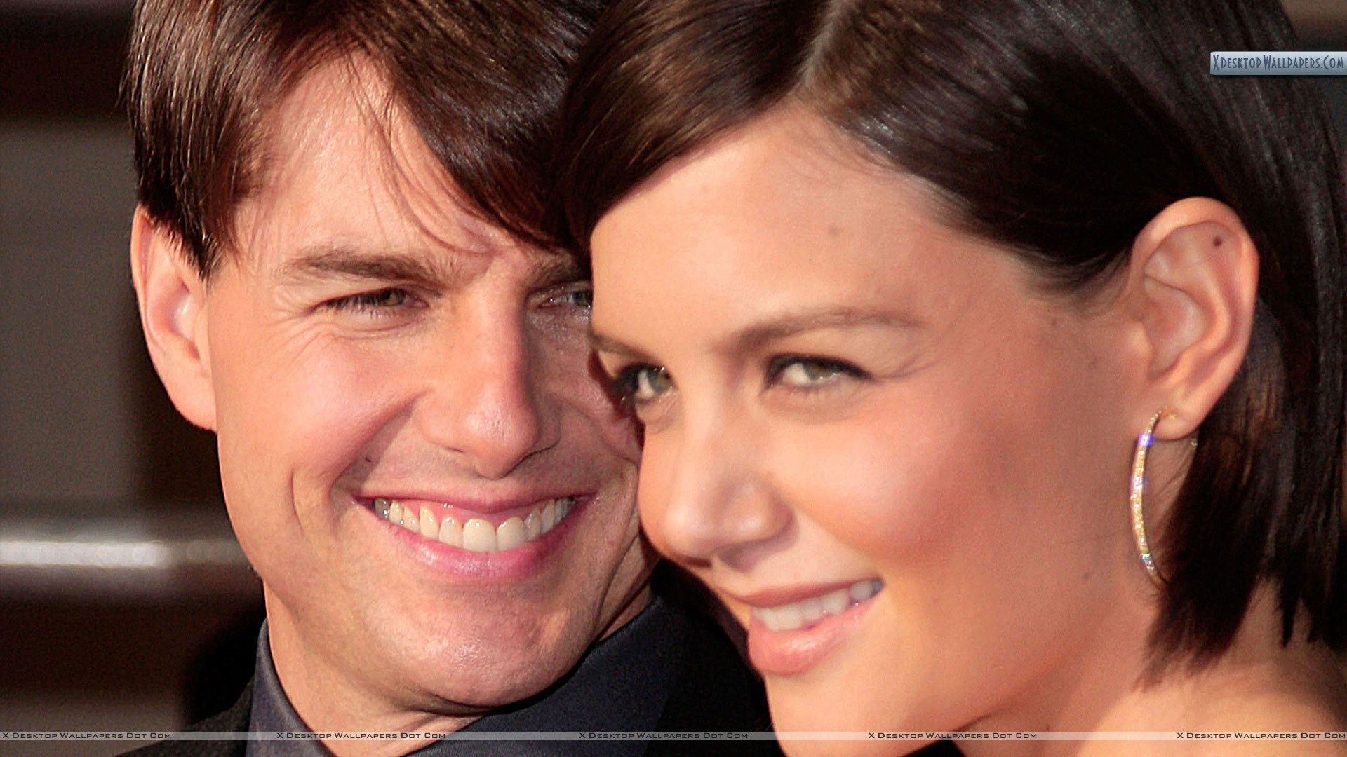 Tom Cruise With Katie Holmes Face Closeups Wallpaper