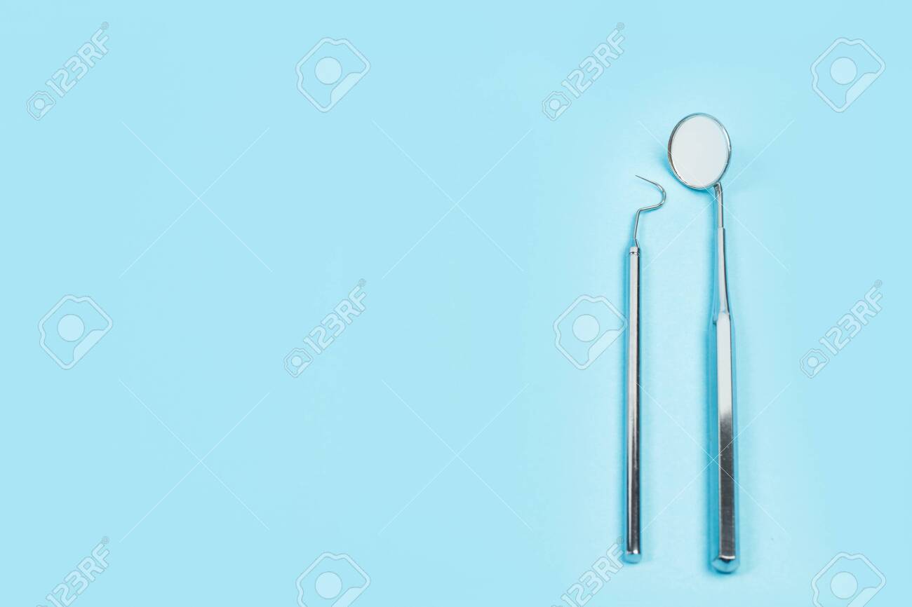 Dental Instruments For Dentistry On A Light Blue Background Stock