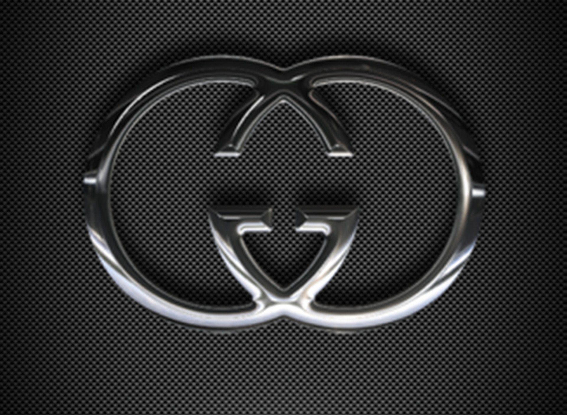 Shiny Silver Gucci Logo on Carbon Fiber Background