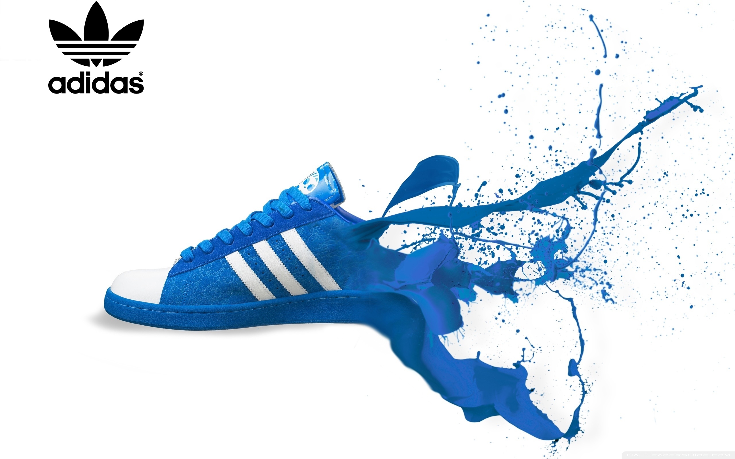Blue Adidas Superstar shoe with blue paint splash