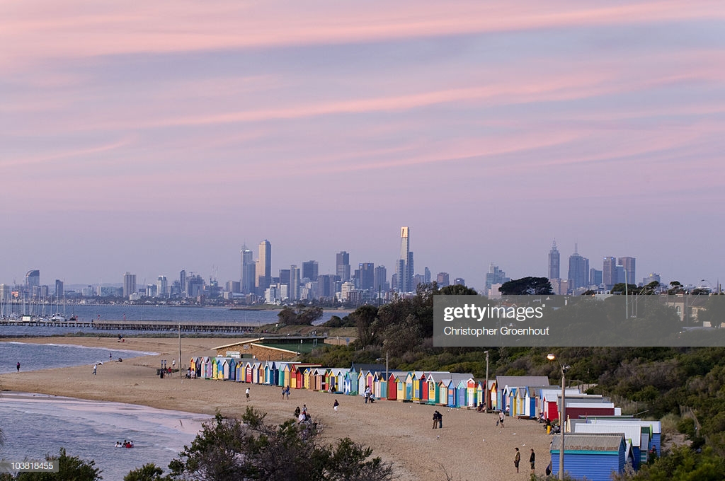 Bathing Boxes At Middle Brighton Beach With City Skyline In
