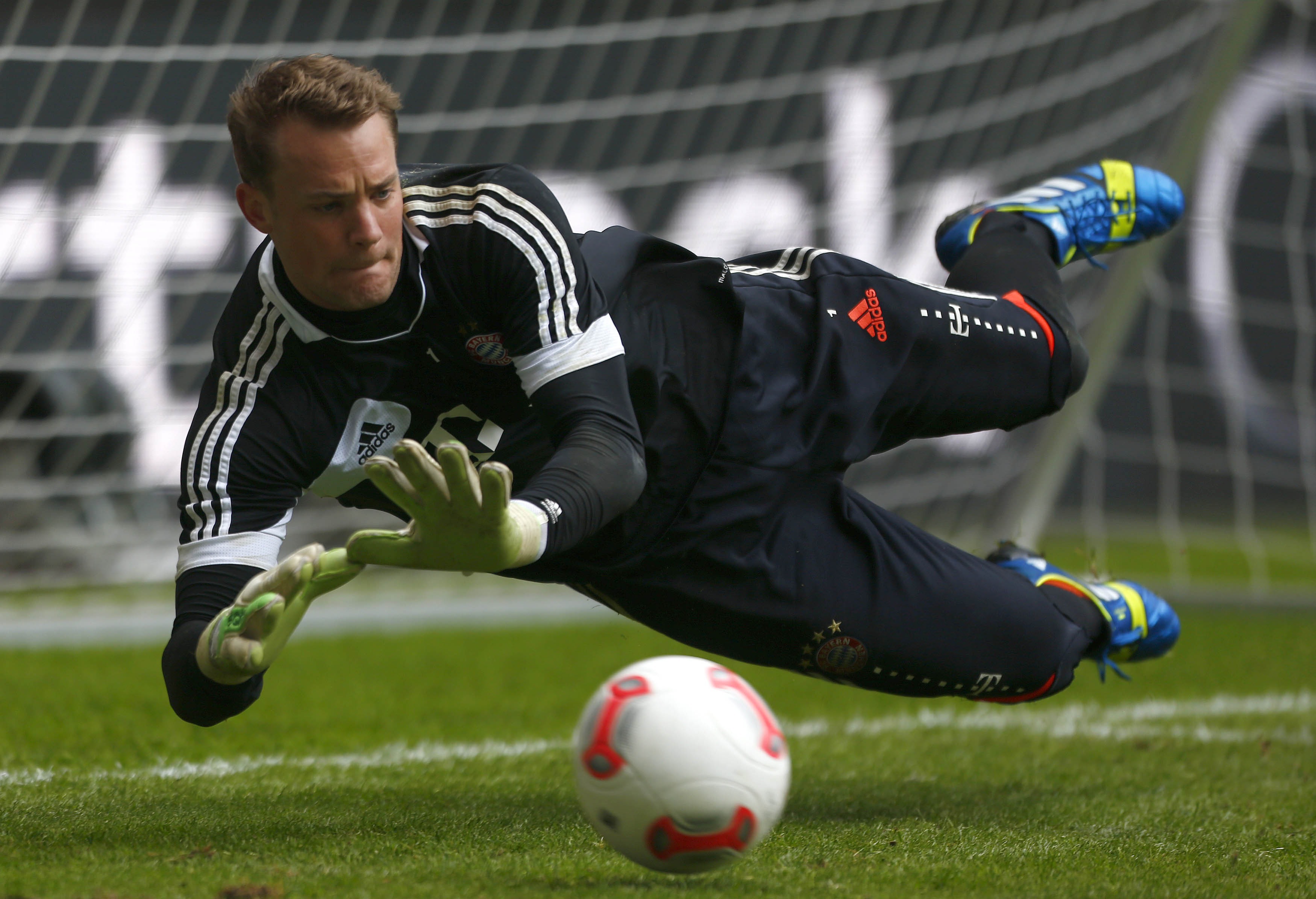 Free download The goalkeeper of Bayern Manuel Neuer is catching a ball