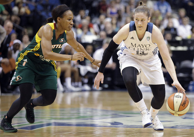 Minnesota Lynx guard Lindsay Whalen 13 protects the ball against the