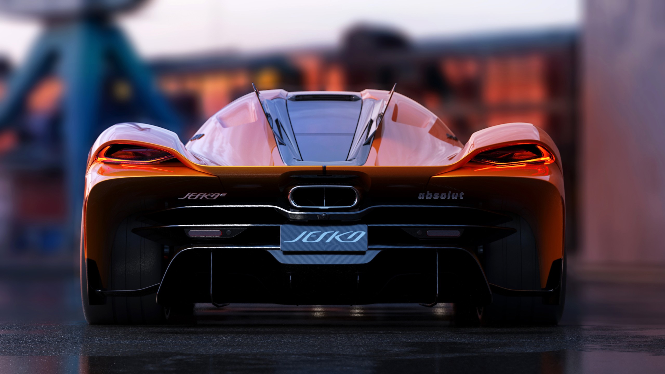 Rear view of a sleek orange Koenigsegg Jesko Absolut in a dimly lit setting, highlighting its aerodynamic design and powerful presence
