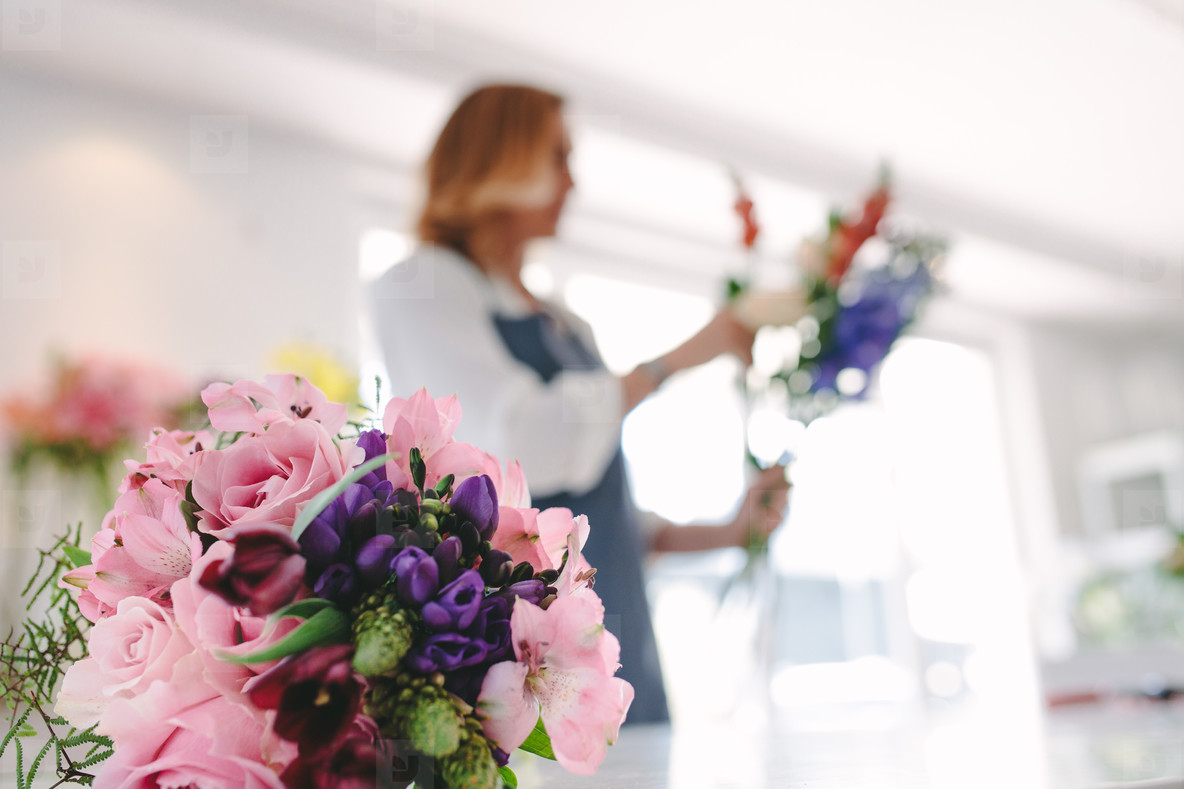 Photos Flower Bouquet In Front With Florist Working