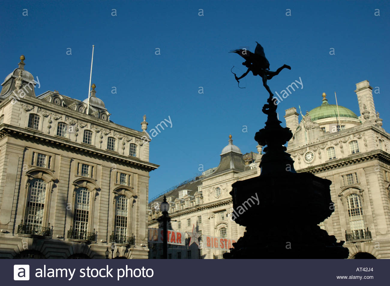 Silhouette Of Eros Statue With Victorian Buildings In The