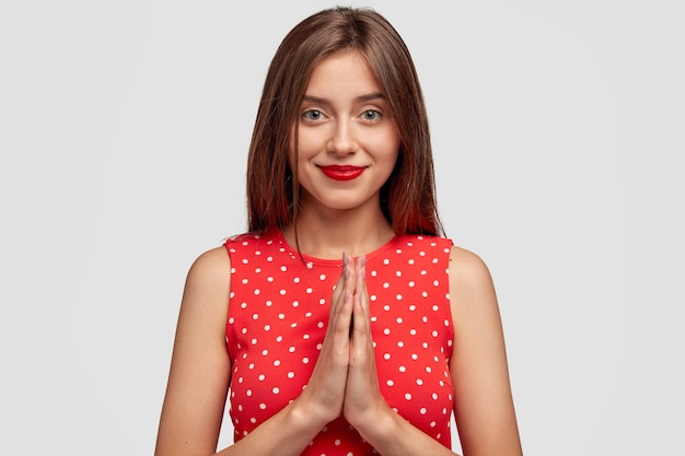Timid Brunette Young Woman Posing Against White Wall Wallpaper
