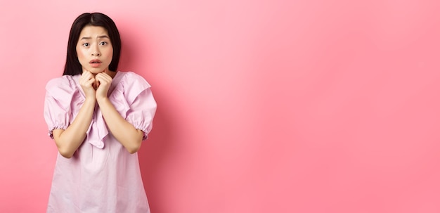 Scared Timid Girl Looking Worried Camera Standing Concerned Pink Background Wallpaper