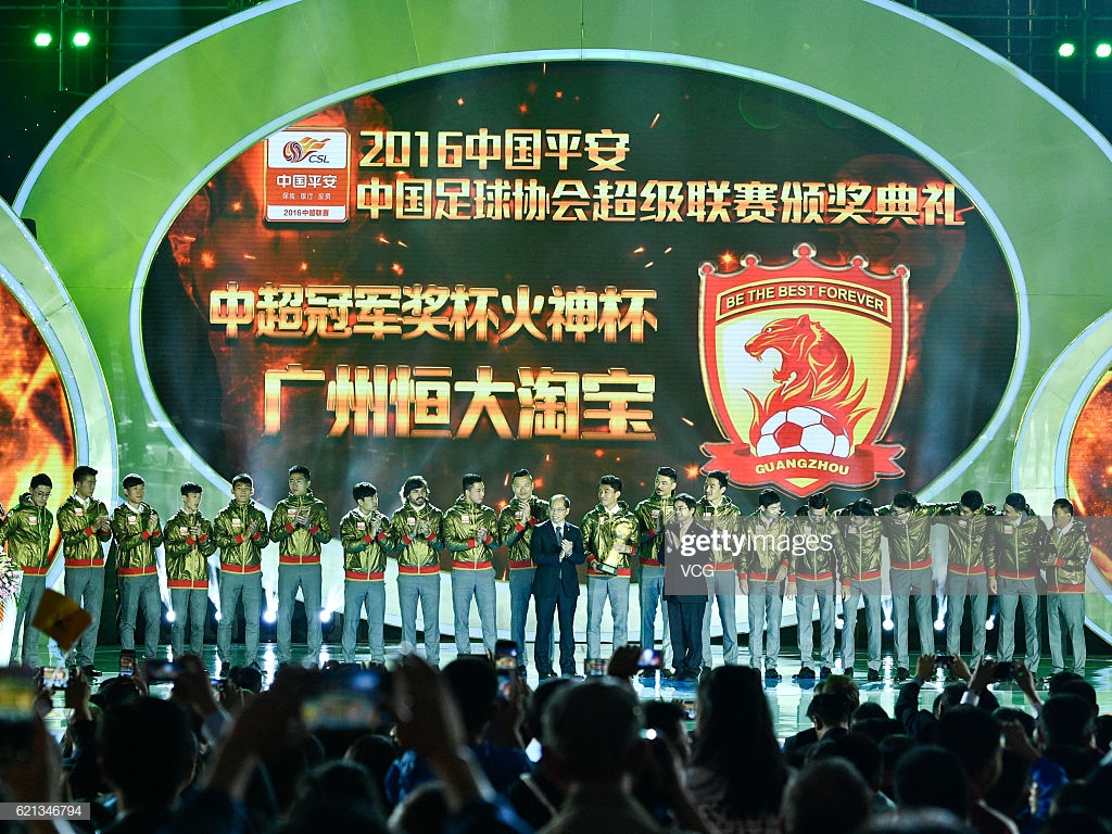 The Guangzhou Evergrande Taobao Football Club receive the winner