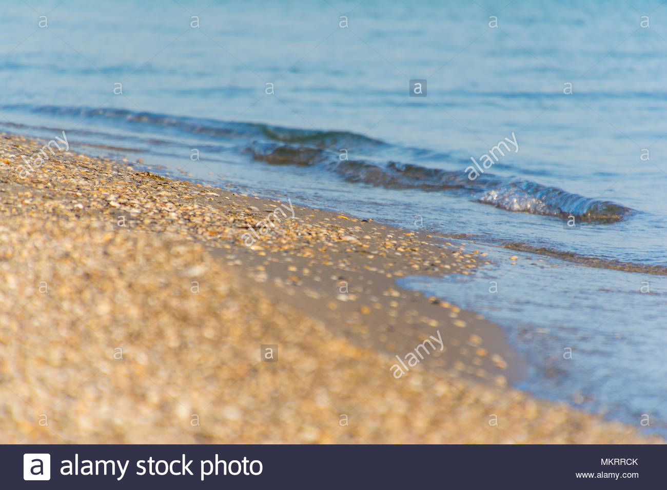 Soft Wave Of Sean On Sandy Beach Background Stock Photo