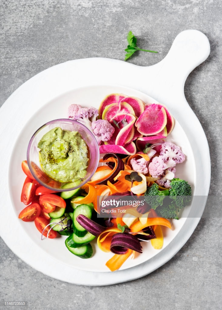 A Platter Of Chopped Vegetables On Gray Background Stock Photo