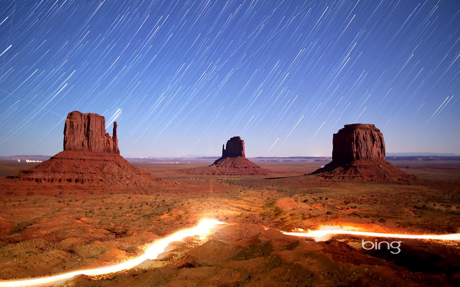 Night Sky And Lights In Monument Valley Navajo Tribal Park