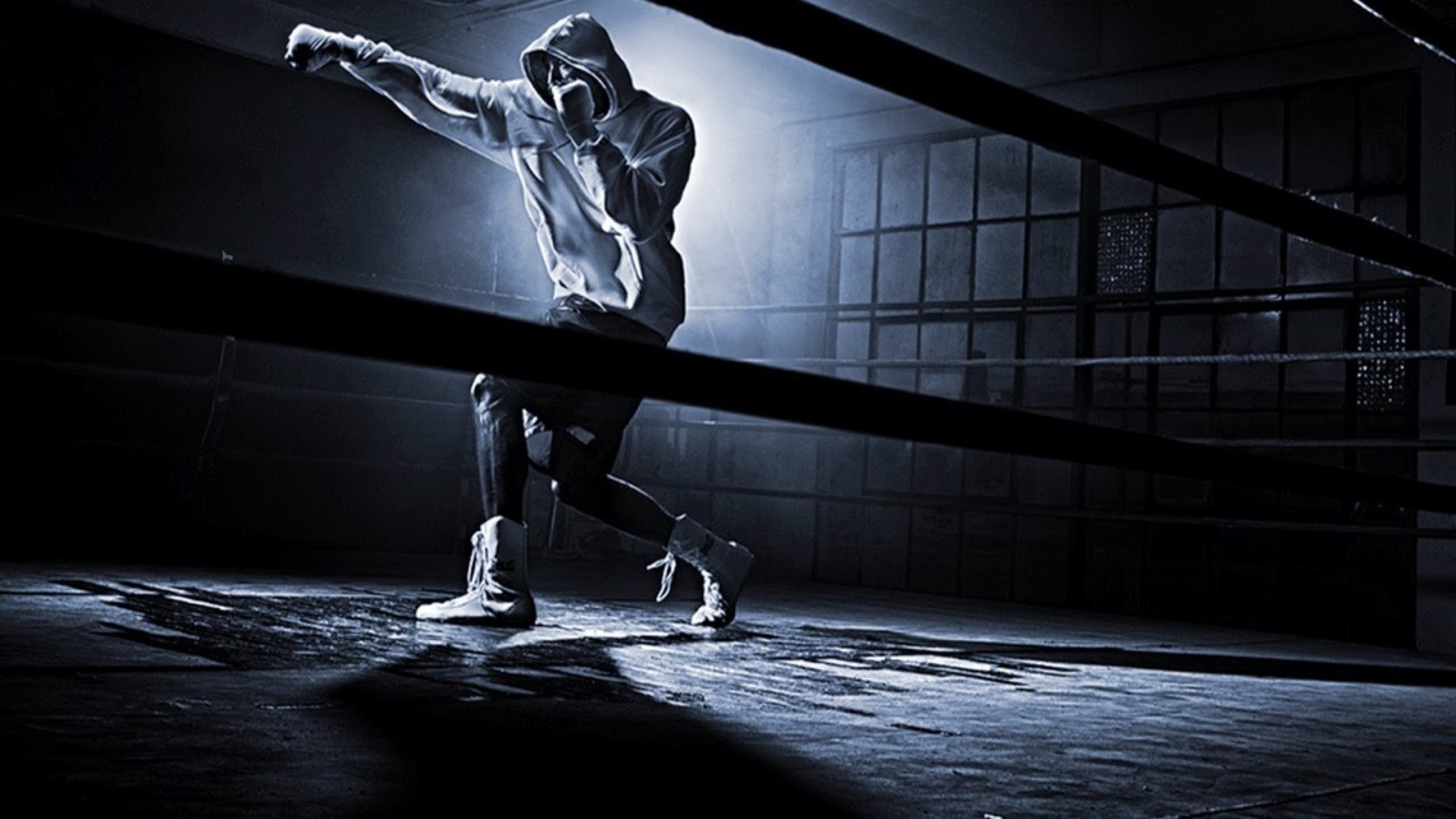 A boxer mid-punch in a dramatic, dark boxing ring, showcasing the intensity and power of martial arts