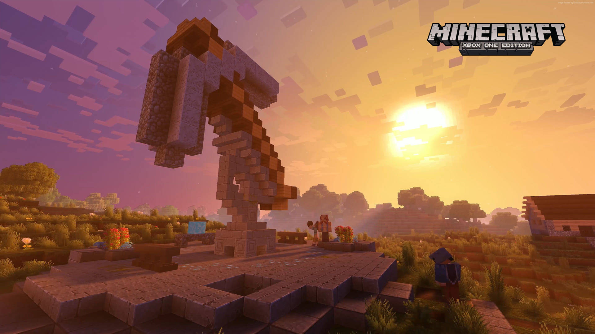 A stunning 4K Minecraft wallpaper showcasing a giant pickaxe statue at sunset