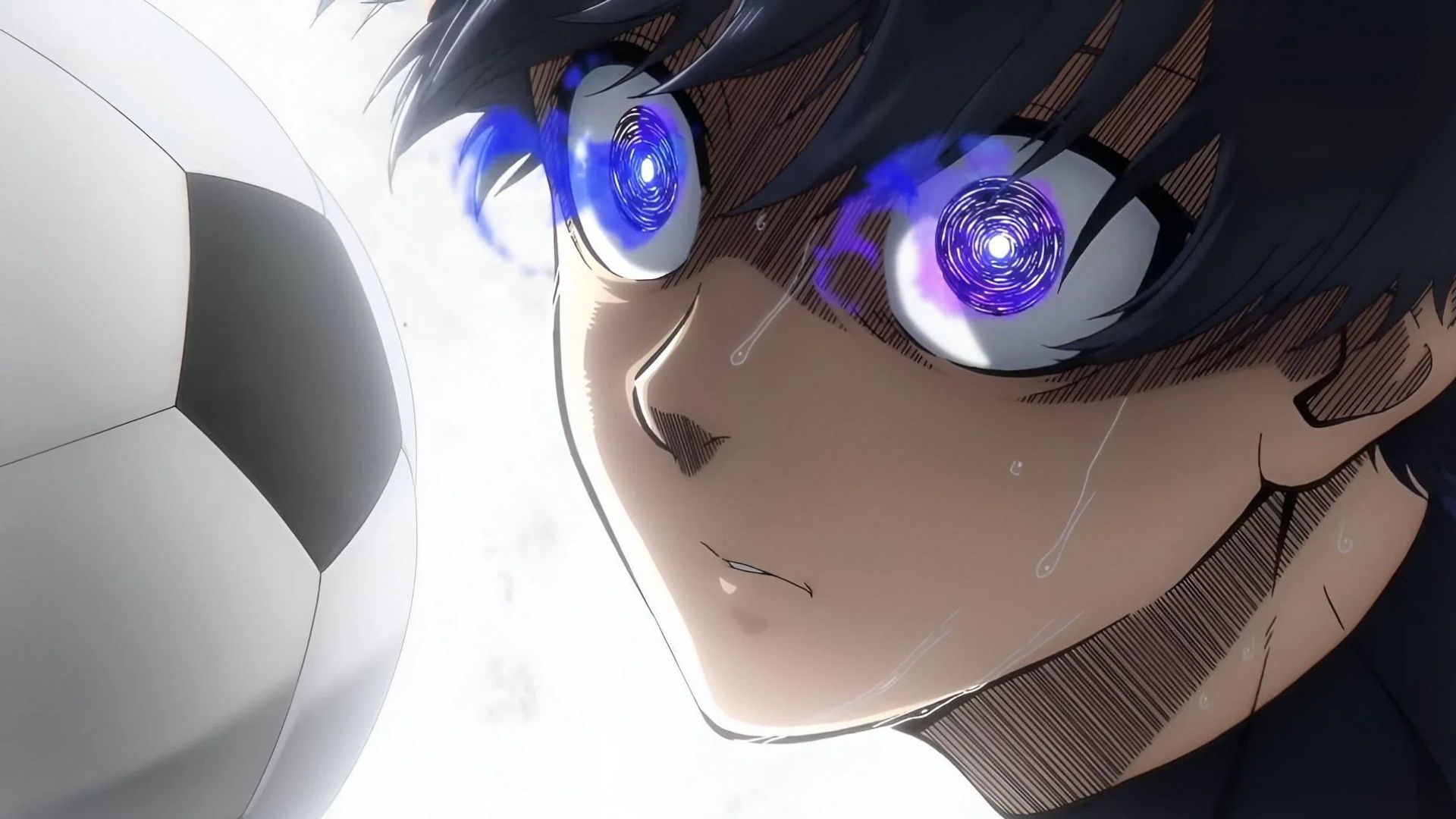 Close-up of Isagi Yoichi with glowing blue eyes, focused on a soccer ball, from the anime 'Blue Lock'