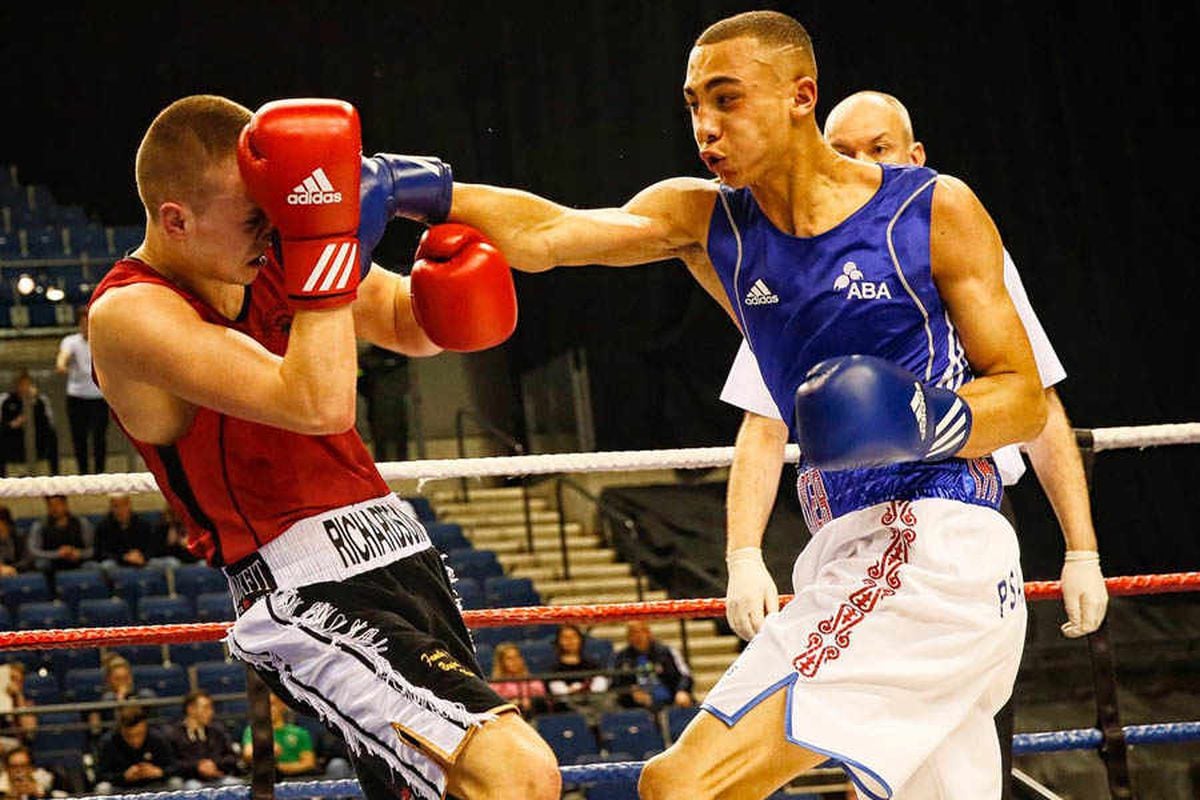 Benjamin Whittaker lands a powerful punch on his opponent during a boxing match
