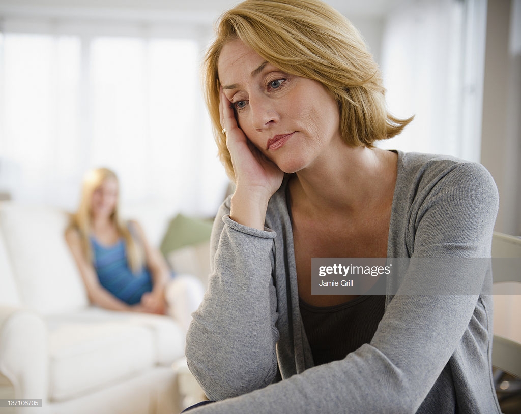 Worried Mother Teenage Daughter In Background Stock Photo Getty