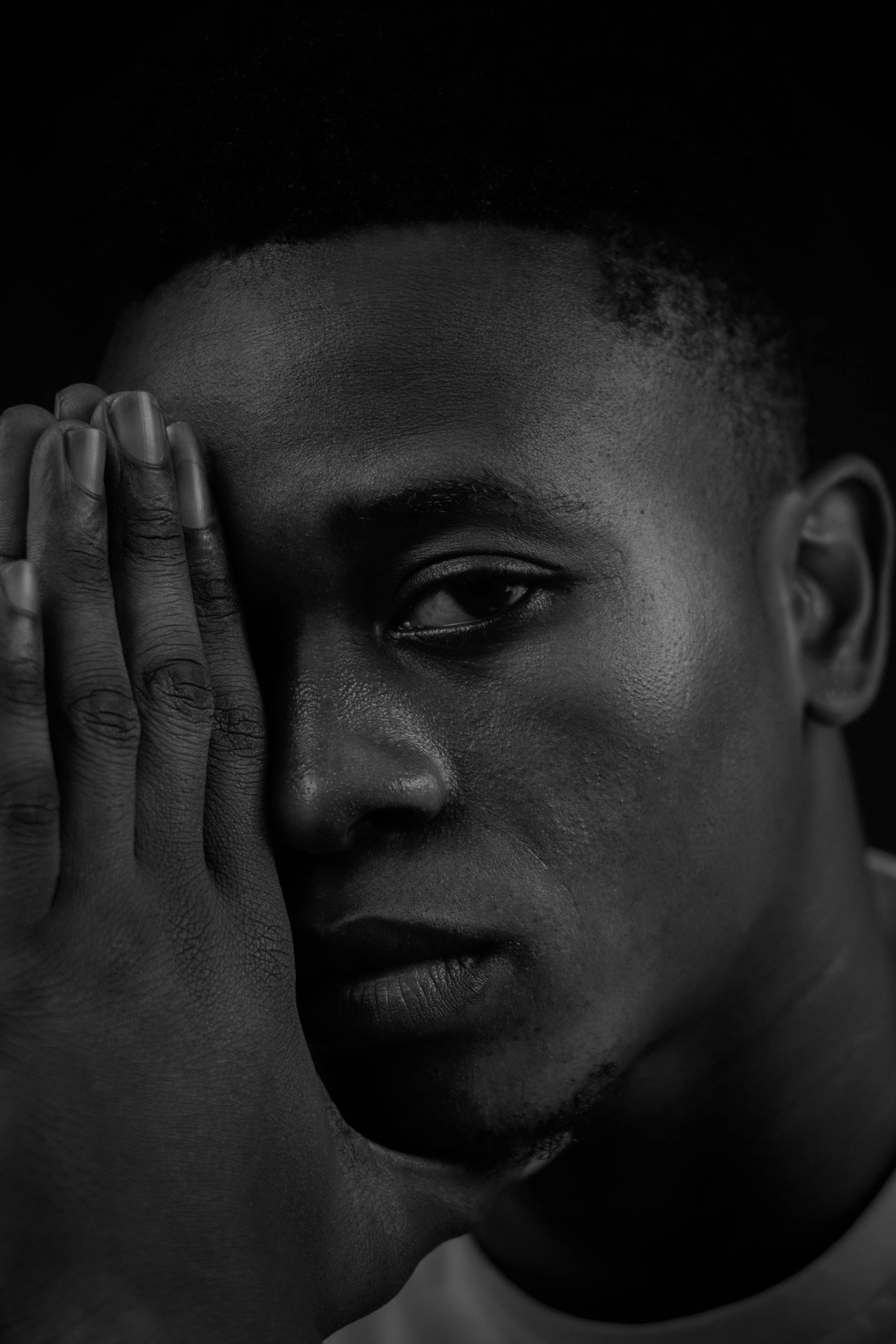 Black And White Portrait Of A Man S Serious Face Wallpaper