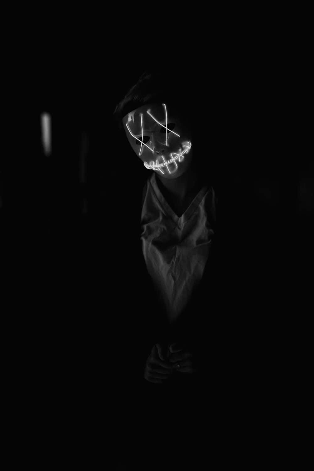 A Black And White Photo Of Person In Mask Wallpaper