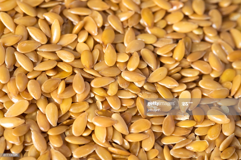 Golden Flax Seed Or Linseed Background High Res Stock Photo