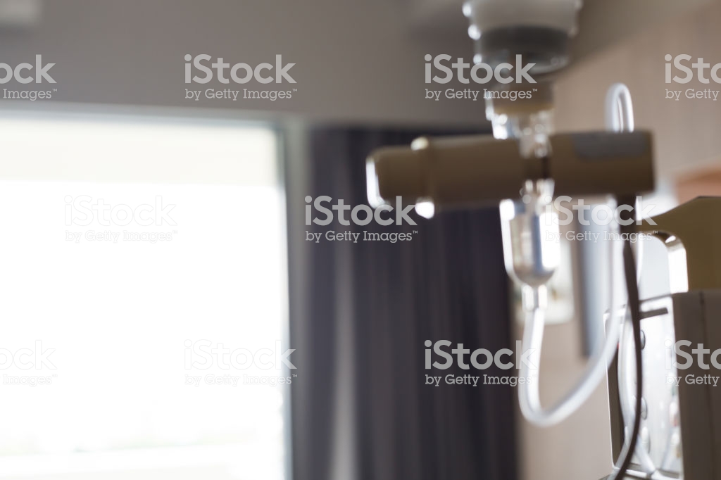 Blurred Image Infusion Iv Drip Saline Solution In Patient Room