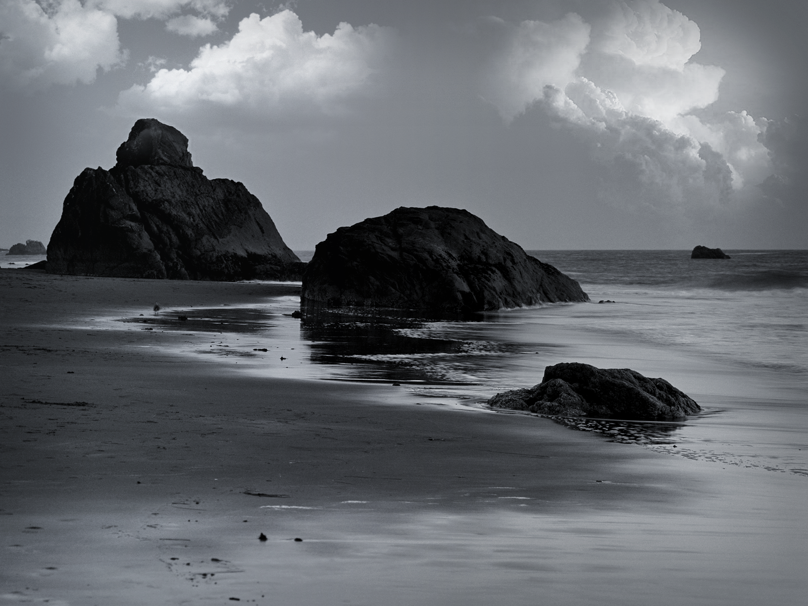 Black And White Beach Rock Formations Wallpaper Conservative