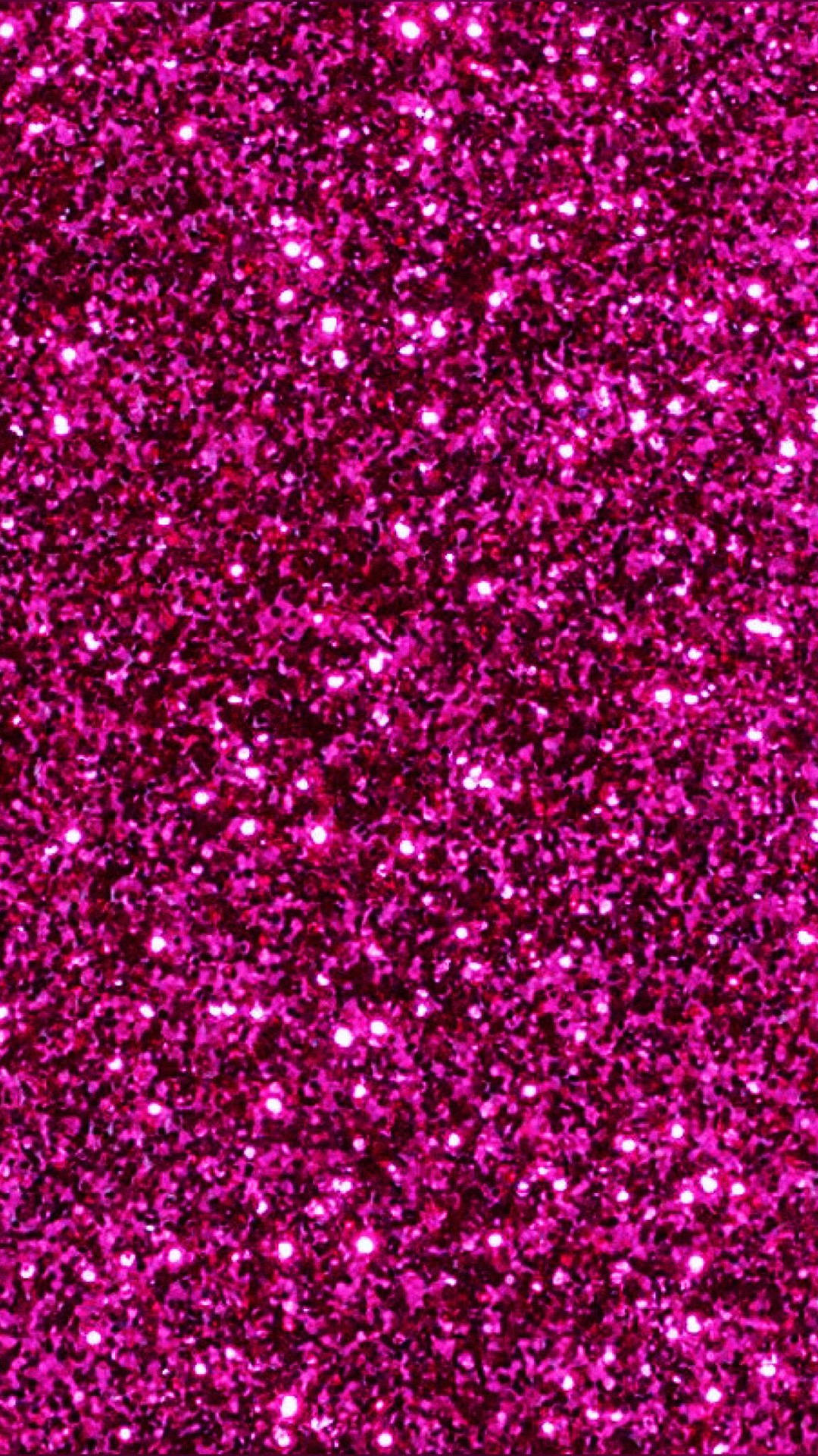 Close-up of vibrant pink glitter, showcasing its sparkling texture and reflective surface